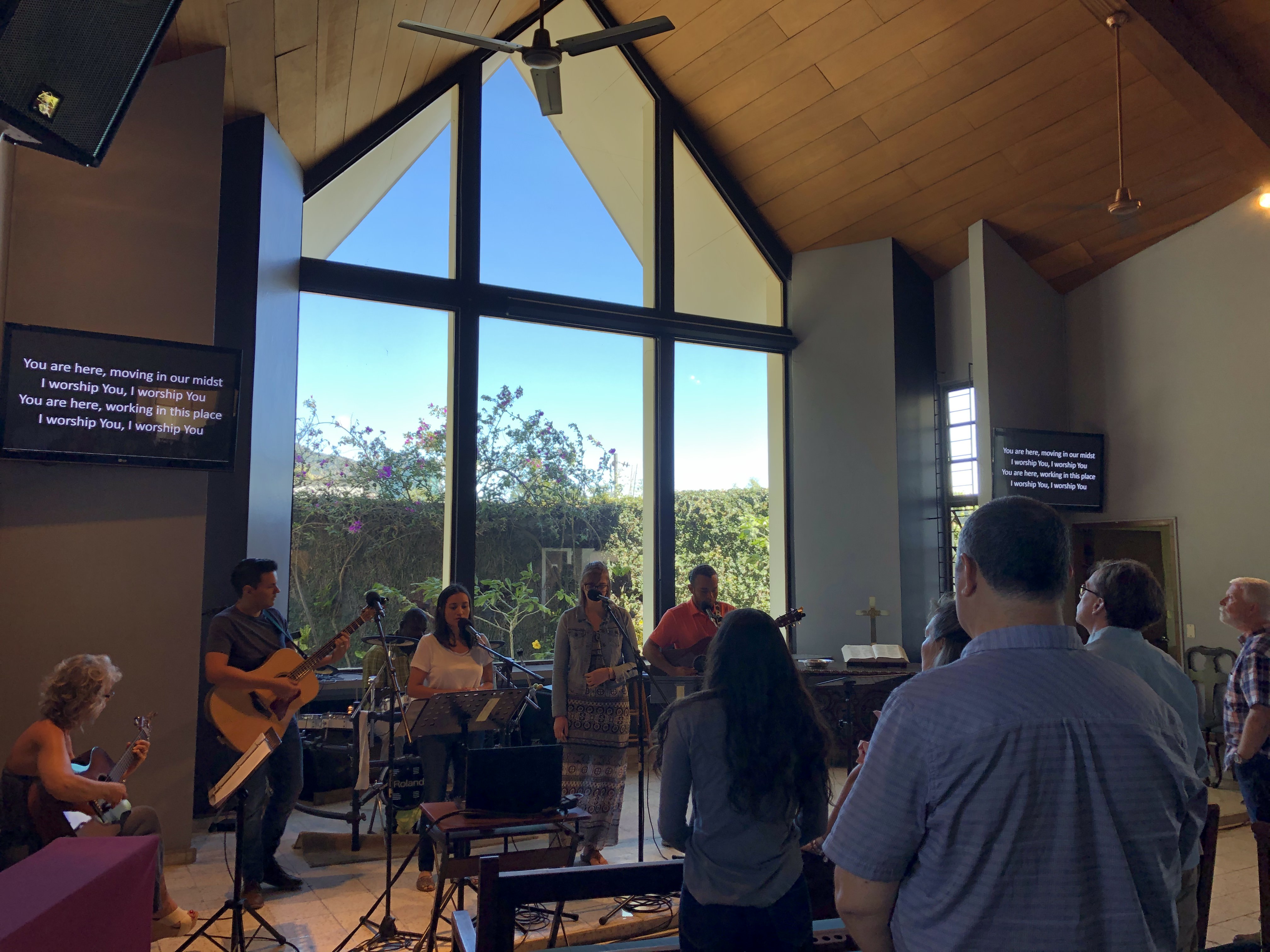 Singing, "You are here, moving in our midst, I worship You, I worship You. You are here, working in this place, I worship You, I worship You."